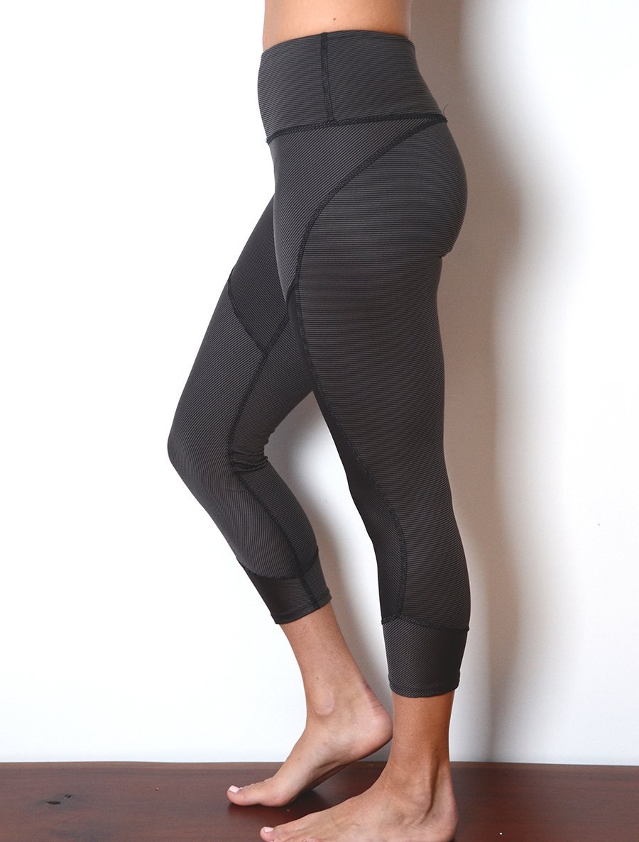 side view of model wearing simulacra's women's cropped leggings