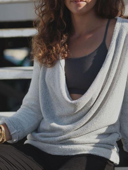 front view of model wearing the low drape neckline of Simulacra's 3-in-1 convertible sweater