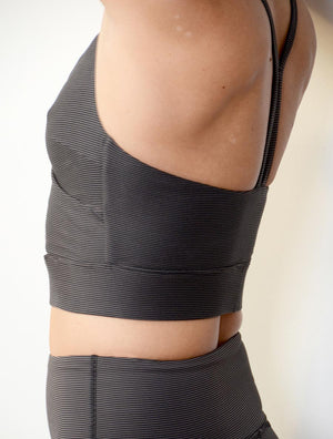 side view of female model wearing the wrap crop top
