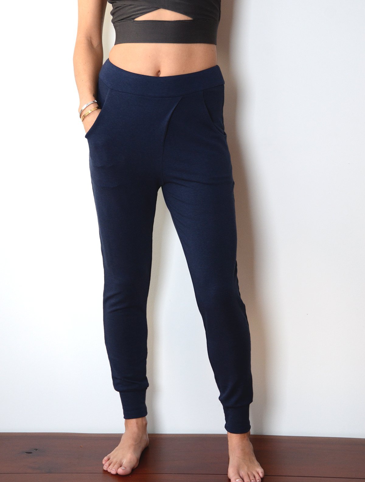 front view of model wearing simulacra's navy blue french terry trouser pants with pockets